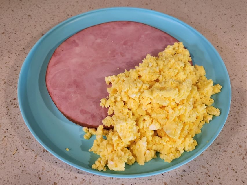 The chicken and pig are both a part of this breakfast, ham and eggs.