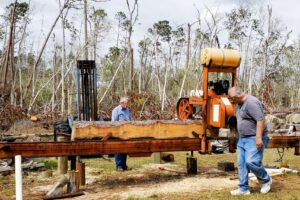 Sawing lumber on this old portable sawmill is considered a hard skill.