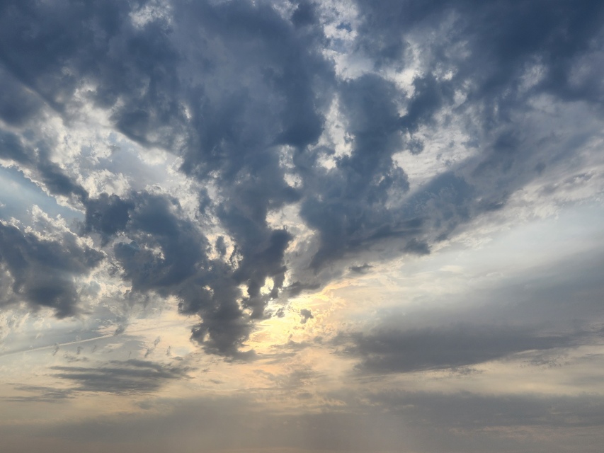The sun is trying to break through the clouds to improve the day. A red flag day is a day with high winds and storm clouds.