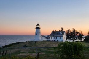 Pemiquid Point Lighthouse overlooking the ocean in Maine, helps with improving attitudes to start finding peace in your life.