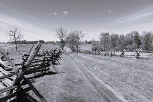 Civil war battlefield fence once divided the northern and southern troops. During those times, bad behavior between Amaricans was celebrated.